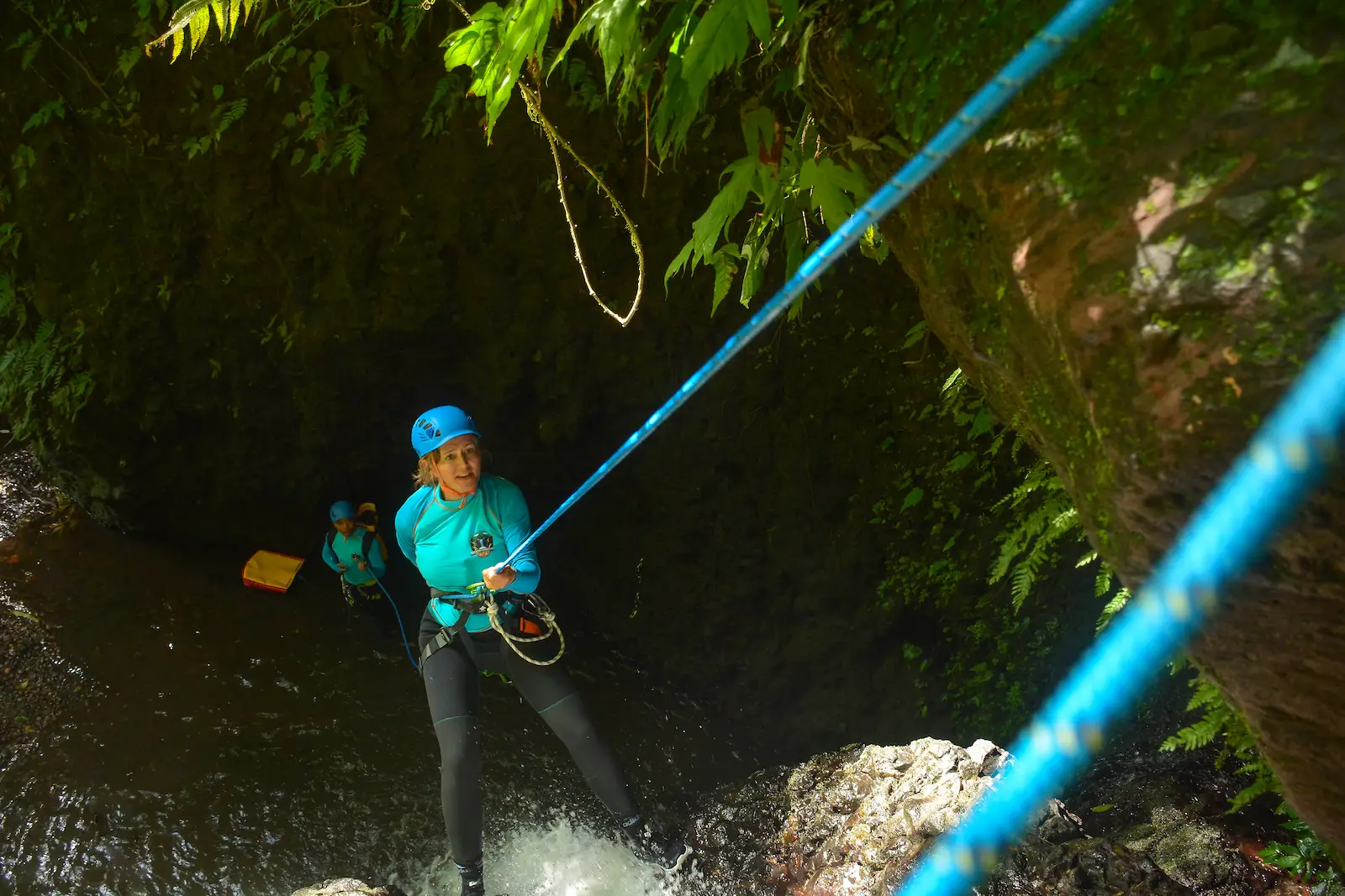 Guest rappelling down a waterfall on the Easy Flow trip
