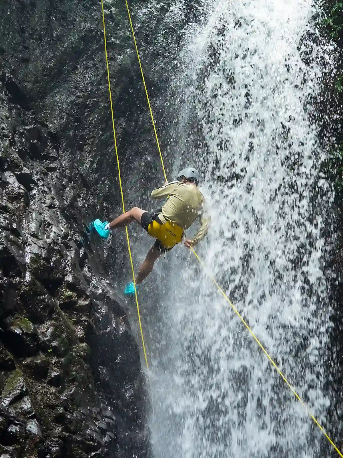 Guest striking a pose at Gitgit Waterfall during Mini Canyoneering