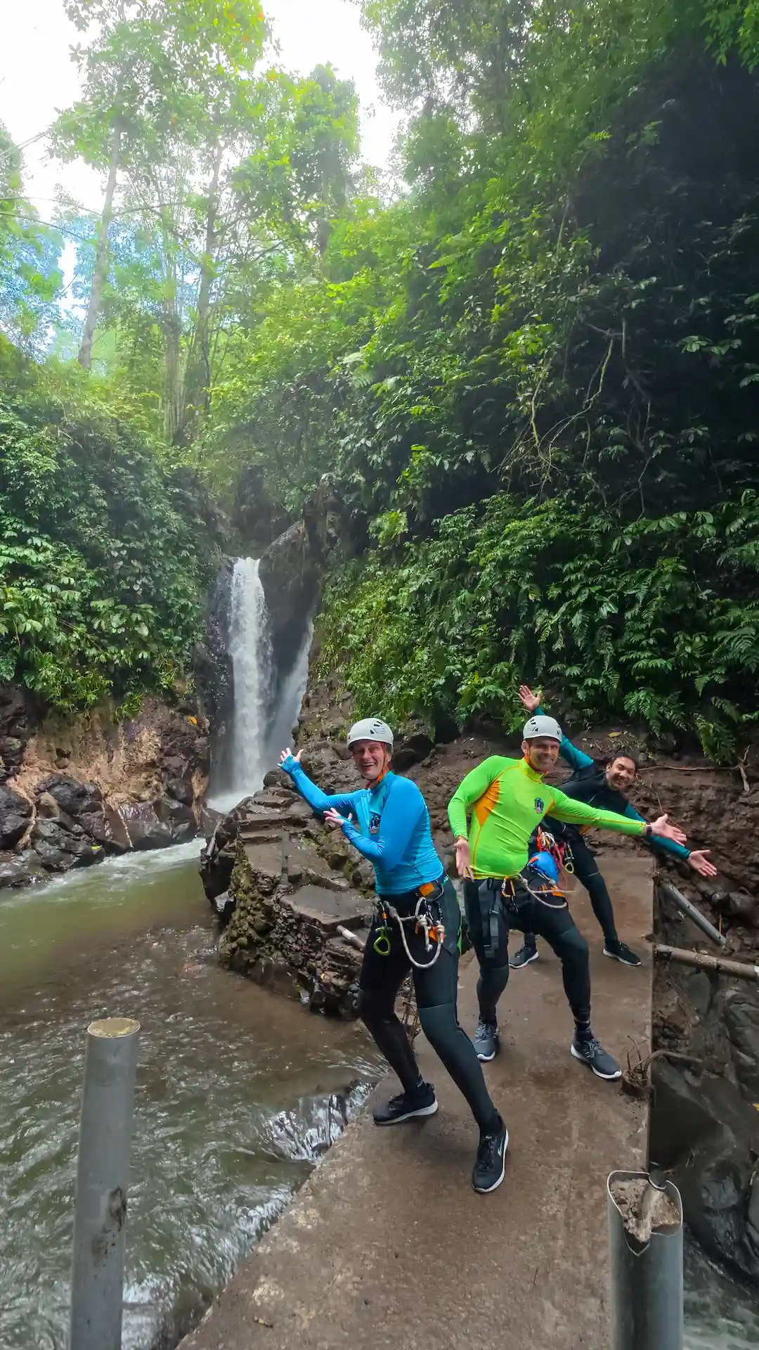 Rappelling through a waterfall on a canyoning trip in North Bali
