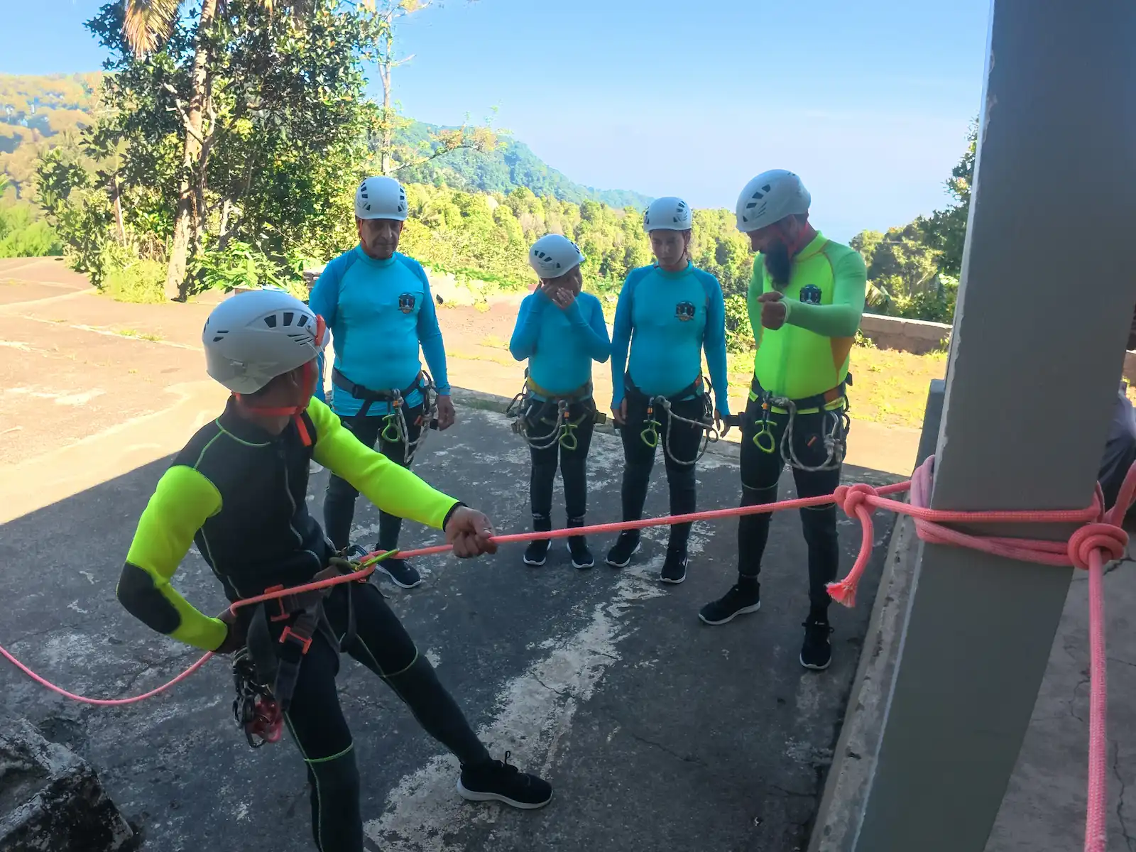 Guides setting up ropes before a canyoning descent